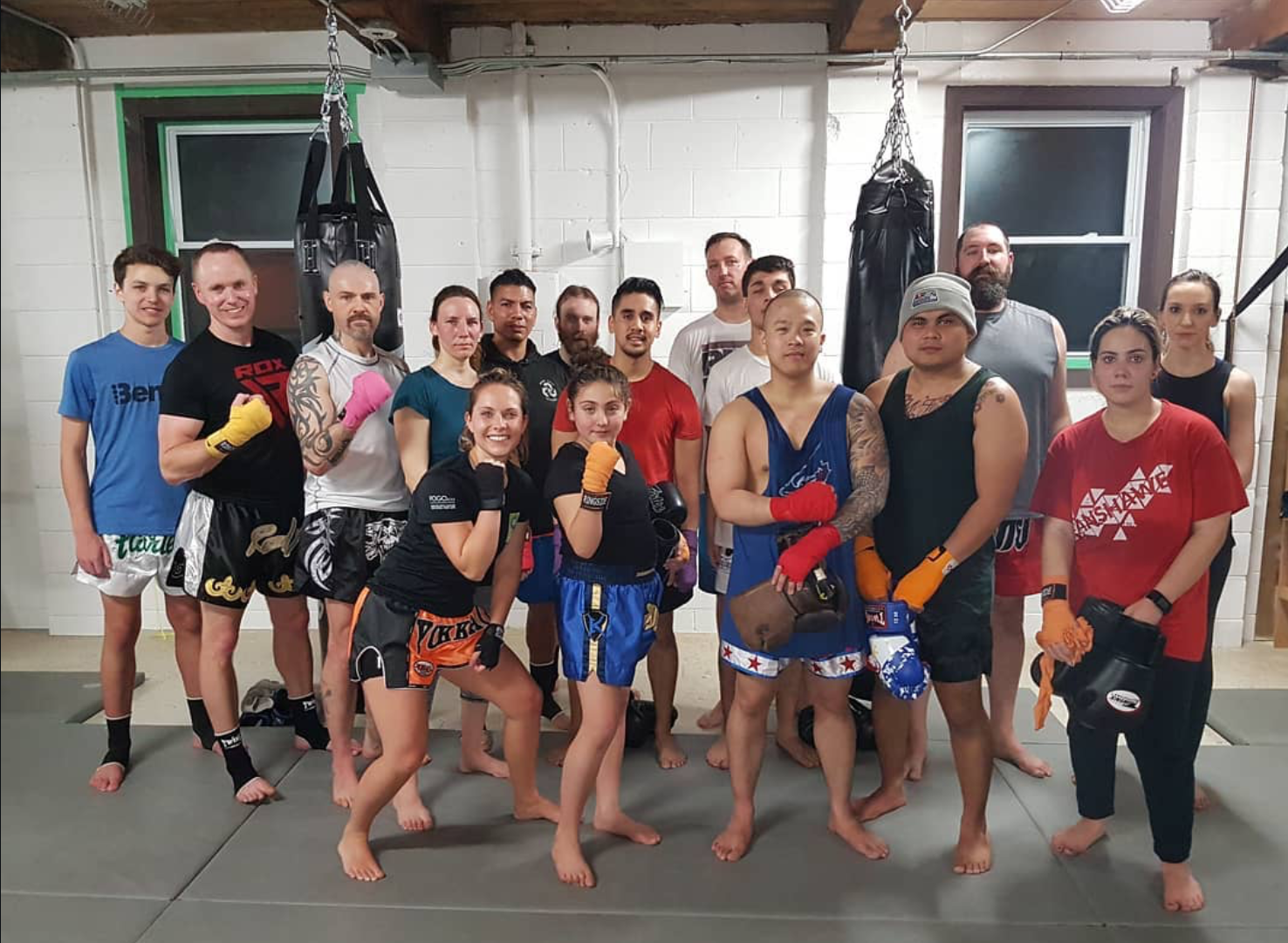 Glory Muay Thai students together on the mats after class